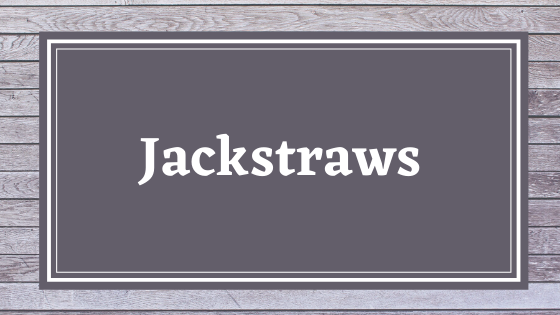 Graphic title card with "Jackstraws" in a white serif font on a dark gray square with a gray wood background.