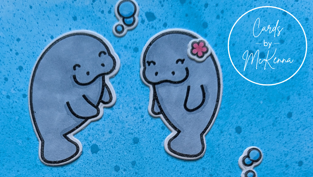Two cute stamped manatees swim next to each other on a bright blue ocean background